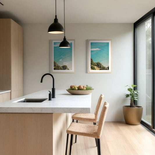 A pair of Byron Bay surf prints hanging on the wall in the kitchen